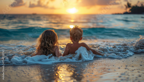 happy children swim in the sea and smile while relaxing on a wet beach on vacation. © Ренат Хисматулин