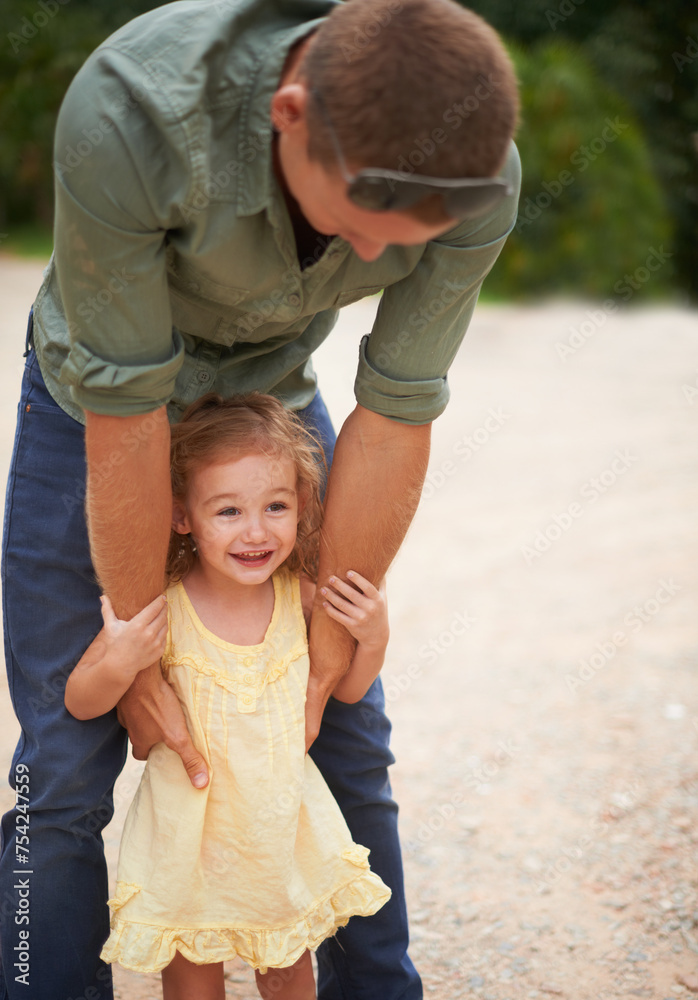 Fototapeta premium Child, smile and outdoor park with father for summer vacation, adventure or weekend holiday trip. Happiness, young girl and male person playing together for love, support and bonding in nature
