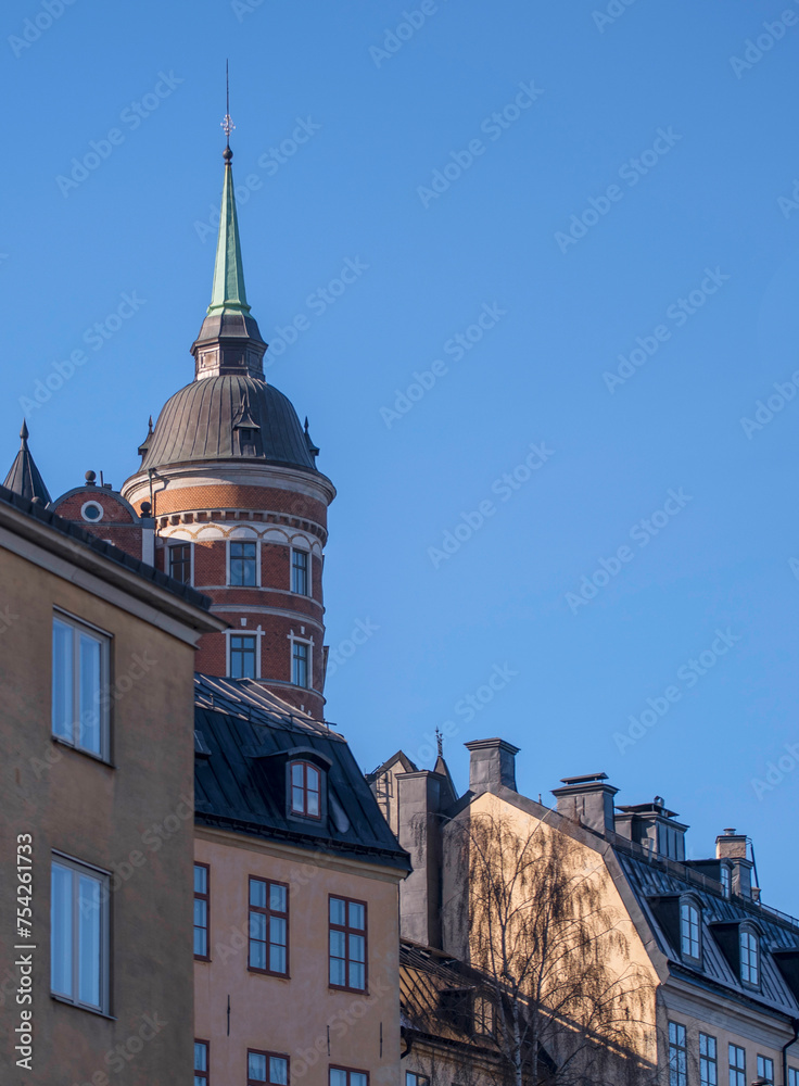 The house Laurinska huset with a brick tower in the district Mariaberget, a sunny winter day in Stockholm