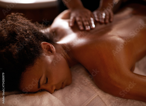 Foto Massage, relax and wellness with black woman at spa on bed or table for luxury pamper treatment