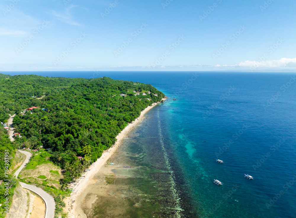 Coastal with turquoise clear water and coral reefs in Carabao Island, San Jose. Romblon. Philippines.