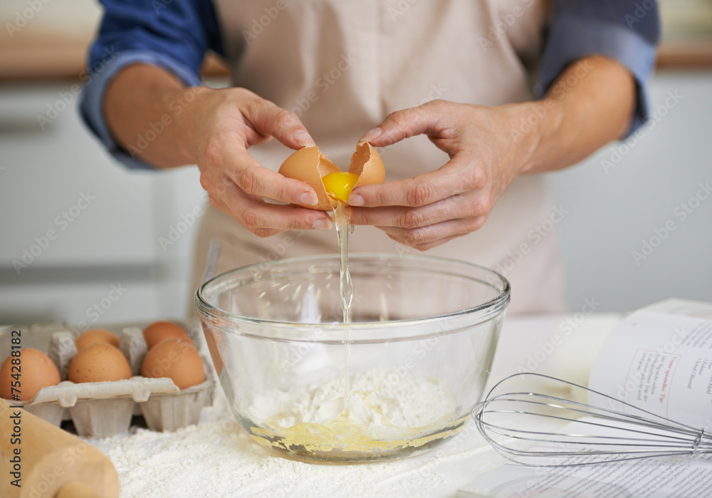 Hands, person and eggs with flour, baking and kitchen for whisk with utensils. Baker, pastry and food with countertop, apron and cookbook for recipe preparation and recreation or hobby at house