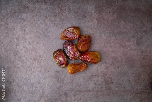 Delicious medjool dates ( kurma ) or sweet dried dates on a plate, as a meal for breaking the fast, ramadan kareem