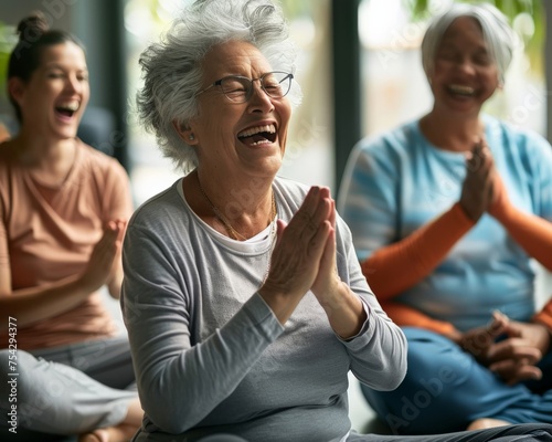 Seniors in a laughter yoga session photo