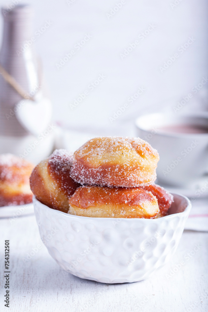 Donuts with sugar and cinnamon served with cocoa. Traditional dessert for Carnival.