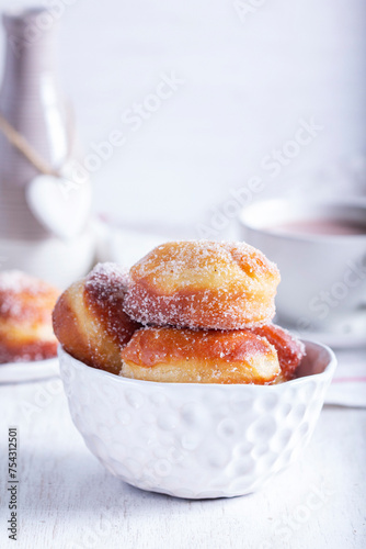 Obraz na płótnie Donuts with sugar and cinnamon served with cocoa. Traditional dessert for Carnival. w salonie