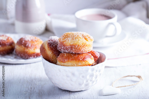 Obraz na płótnie Donuts with sugar and cinnamon served with cocoa. Traditional dessert for Carnival. w salonie
