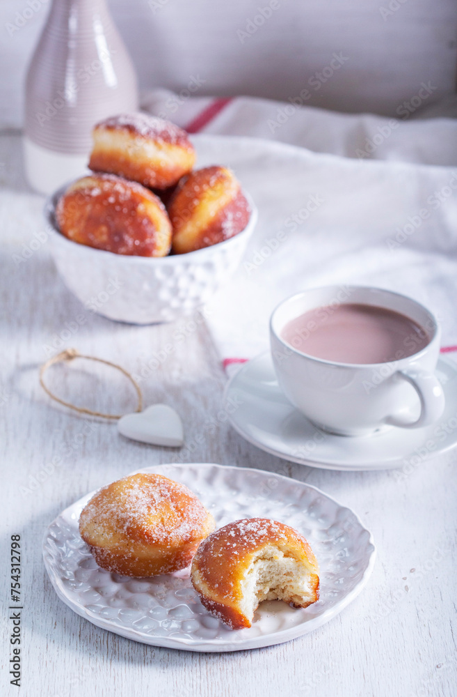 Donuts with sugar and cinnamon served with cocoa. Traditional dessert for Carnival.