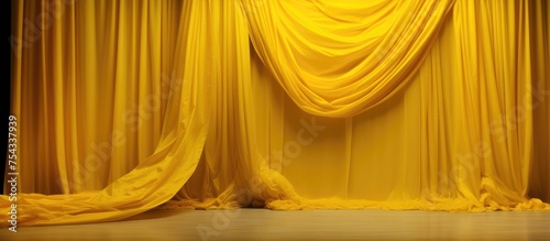 A stage featuring a vibrant yellow curtain hanging in the background, contrasted against a clean white floor. The simplicity of the setting allows for a striking visual impact.