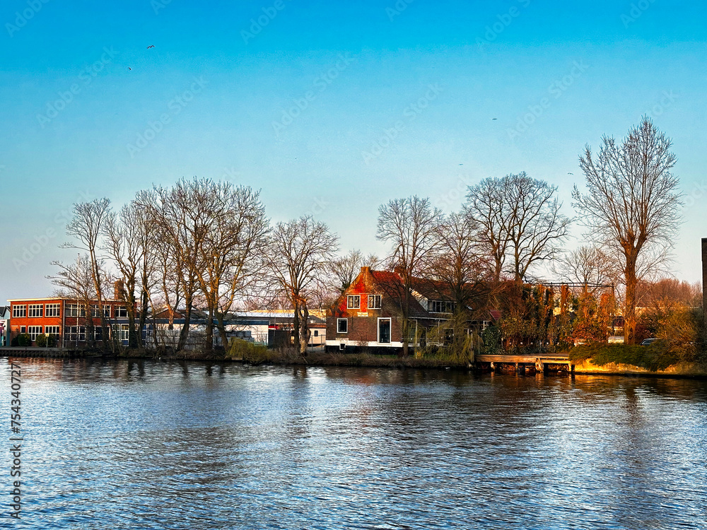 Fototapeta premium Haarlem is a city outside of Amsterdam in the northwest Netherlands.. The Spaarne is a partially canalized river running through Haarlem.