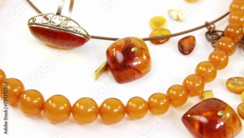 Beautiful jewelry from natural amber on white backgroundN photo