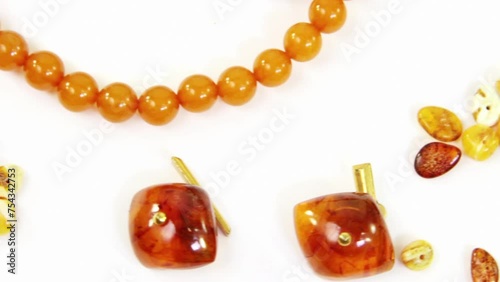 Various jewelry from natural amber on white backgroundN photo