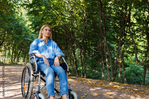 Freedom in Motion: Woman in Wheelchair at the Park © Andrii 