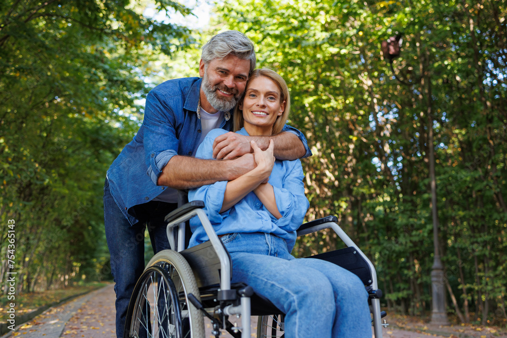 Inclusive Park Stroll: Man and Woman in Wheelchairs Inclusive Park Stroll: Man and Woman in Wheelchairs