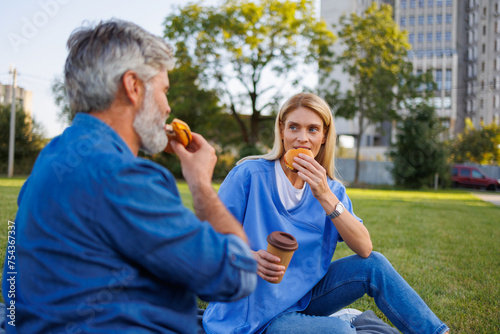 Burger bliss: Patient and caregiver relax with outdoor picnic