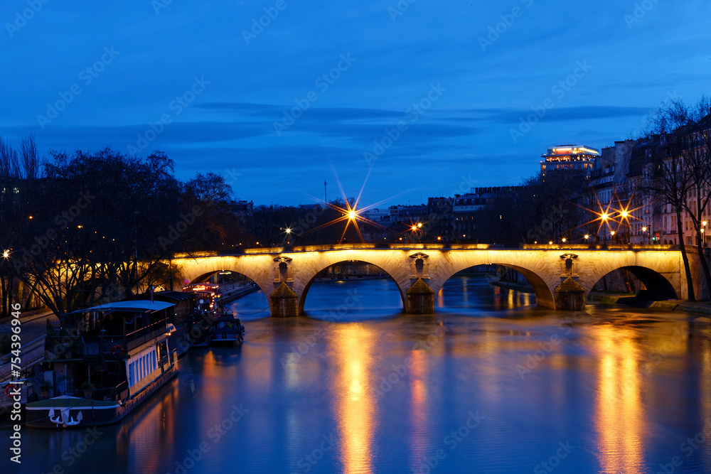 Fototapeta premium The view of bridge Ponte Marie over Seine river at night , Paris, France. It is one of the oldest bridges in Paris.