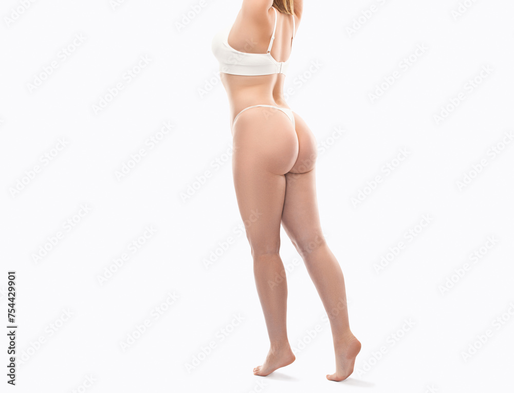 A +size woman in white underwear on a white background. Healthy lifestyle, sport and diet.