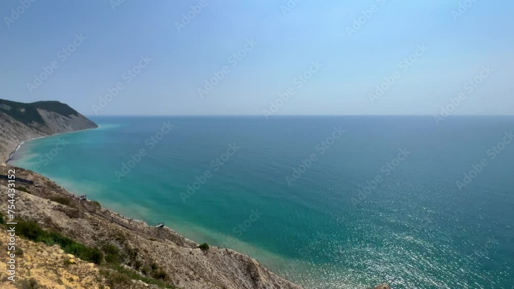 Panoramic view of the sea surface from the coast. Black Sea, Anapa, Krasnodar Territory, Russia. Sunset view of Bald Mountain near the village of Supseh. The beach has 800 steps. 4K Video Panoramic view of the sea surface from the coast. Black Sea, Anapa, Krasnodar Territory, Russia. Sunset view of Bald Mountain near the village of Supseh. The beach has 800 steps. 4K Video