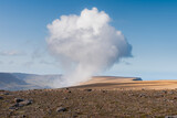 Rocky landscape with huge cumulus cloud formed on top of Bolafjall mountain, Westfjords, Iceland