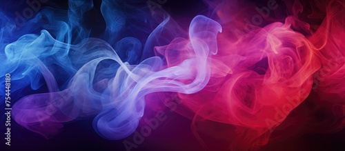 A group of dramatic smoke clouds in vivid red, blue, and purple colors billowing on a black background. The contrasting hues create an intense abstract scene, perfect for a unique background or