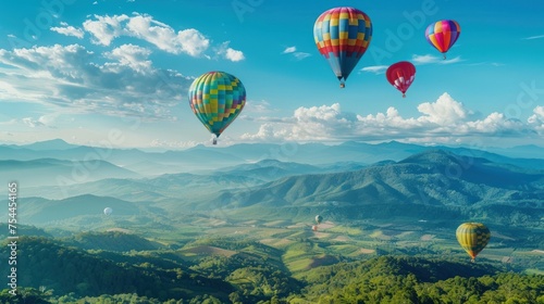 A group of hot air balloons are flying over a beautiful mountain landscape. The scene is peaceful and serene
