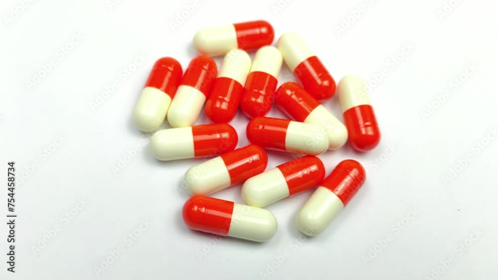 Rotating capsule medicine isolated on a white background Rotating capsule medicine isolated on a white background