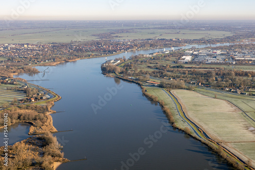 Aerial view Dutch river Lek with view at village Schoonhoven