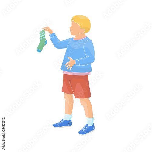  boy holding a sock in his hands	
