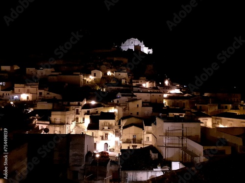 Veduta panoramica notturna di Scicli, le casette, i vicoli e la chiesa di San Matteo. photo