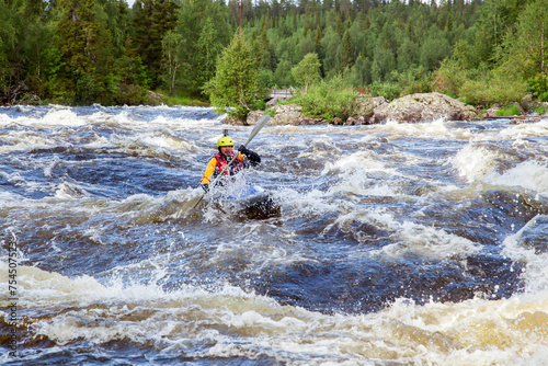 Kayaker in whitewater on a Karelian river © Nadezhda Bolotina