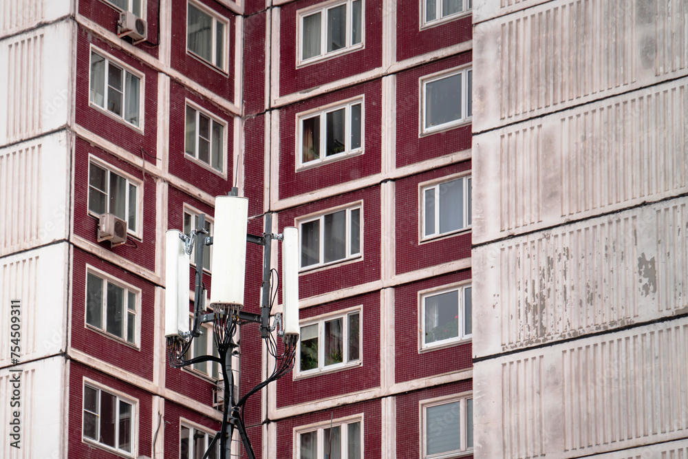 Fototapeta premium Cell Phone Antennas Near Residential Apartments Security Breach