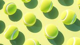 Tapeta o grupie piłek tenisowych ułożonych symetrycznie obok siebie, tworząc interesujący wzór. Cień pada na bok.
