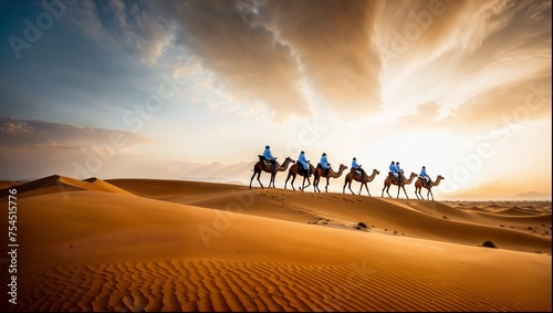 A camel caravan journeys through the desert, accompanied by Saudi people dressed in traditional white attire.