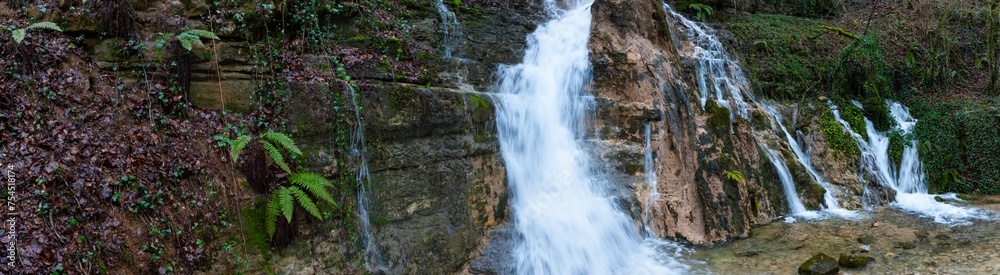 Obraz premium El Molino waterfall in Villabáscones de Bezana in the Valdebezana Valley. The Merindades region. Burgos. Castile and Leon. Spain. Europe