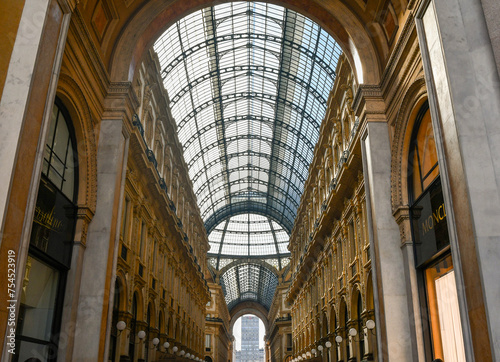 Low-angle view of Galleria Vittorio Emanuele II (1877), the Italy's oldest active shopping gallery in the city centre of Milan, Lombardy, Italy