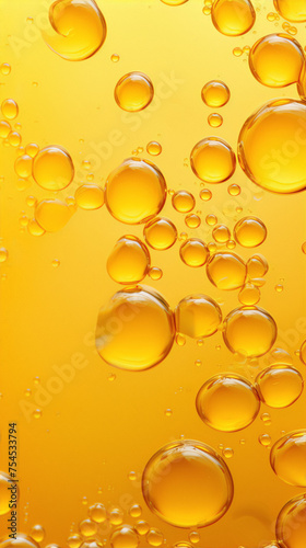 Abstract yellow bubbles floating in a yellow liquid.