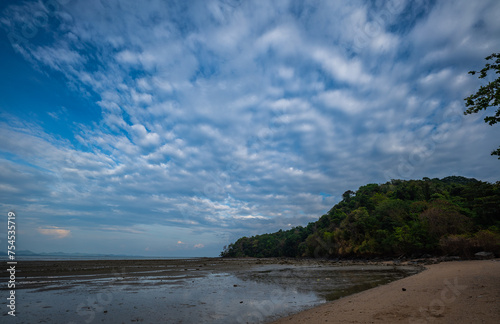 white clouds in the blue sky The sun shines through. .birds flying in the sky The wind that blows through.The clouds move and change shape with the force of the wind. .beautiful nature in the sky