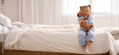 Cute little girl with toy b...