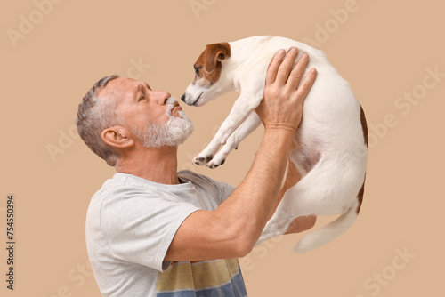 Senior man with cute dog on...