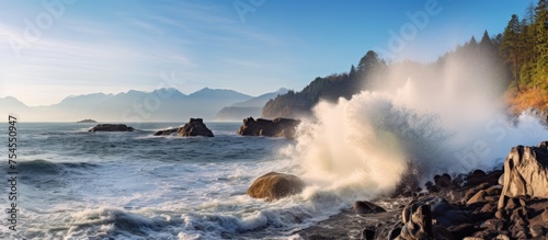 Majestic Power of Nature: Stunning Image of a Massive Ocean Wave Crashing on Rocky Shoreline