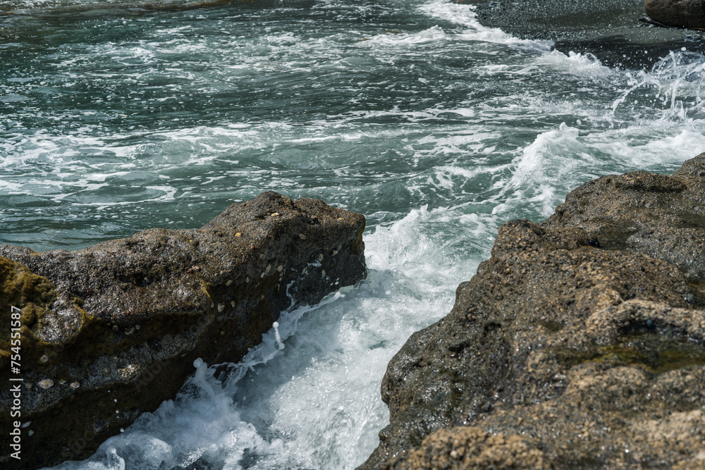 waves crashing on rocks