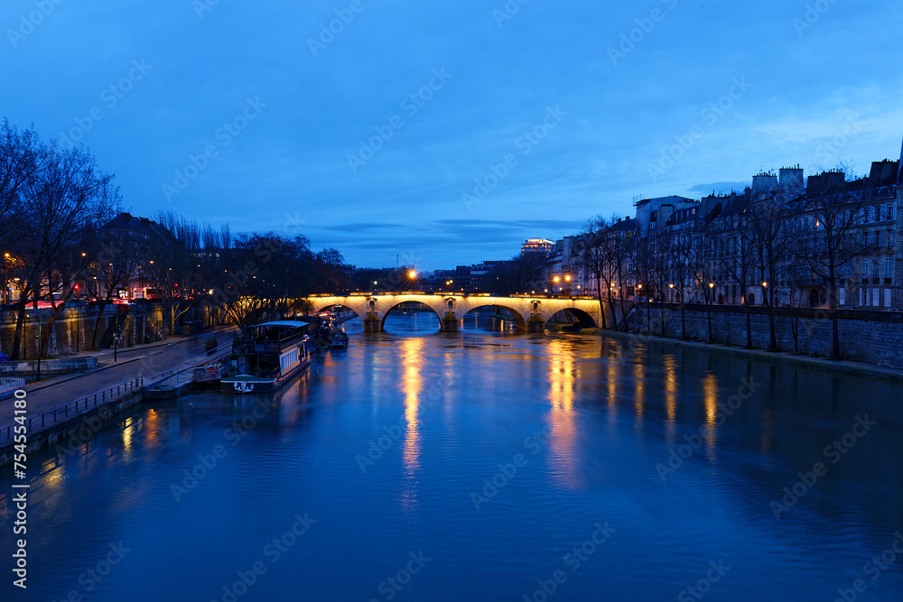 The view of bridge Ponte Marie over Seine river at night , Paris, France. It is one of the oldest bridges in Paris.