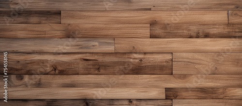 A detailed view of a natural wood textured floor with a rich brown background. The wood tiles are arranged tightly, showcasing the intricate grain patterns and warm tones.