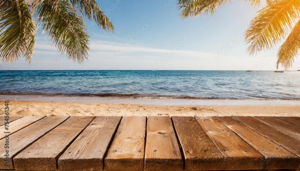 a wooden table on the beach, with the water next to it; vacation concept; summer holidays 