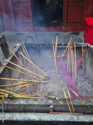 Burning incenses in Yonghe Temple commonly called Lama Temple in Beijing, China photo
