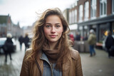 White Beautiful Woman in her 20s or 30s talking head shoulders shot bokeh out of focus background on a cosmopolitan western street vox pop website review or questionnaire candid photo