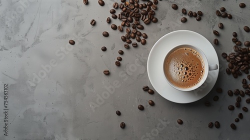 A coffee cup and coffee beans arranged on a kitchen table. The view is from above, leaving space for your text