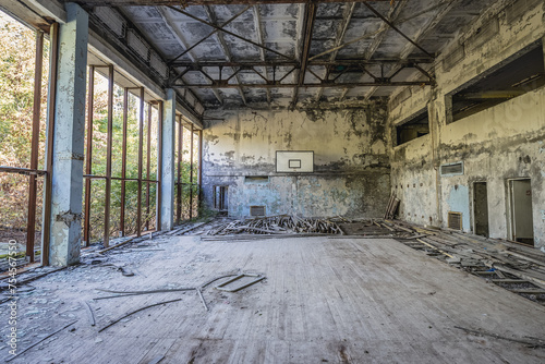 Basketball court in building of Azure Swimming Pool in Pripyat ghost city in Chernobyl Exclusion Zone, Ukraine