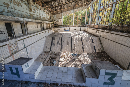 Azure Swimming Pool in Pripyat ghost city in Chernobyl Exclusion Zone, Ukraine