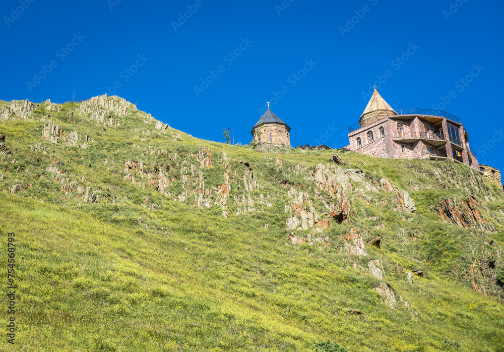 Tsminda Sameba - Trinity Church in Caucasus Mountains in Gergeti village near Stepantsminda, Georgia